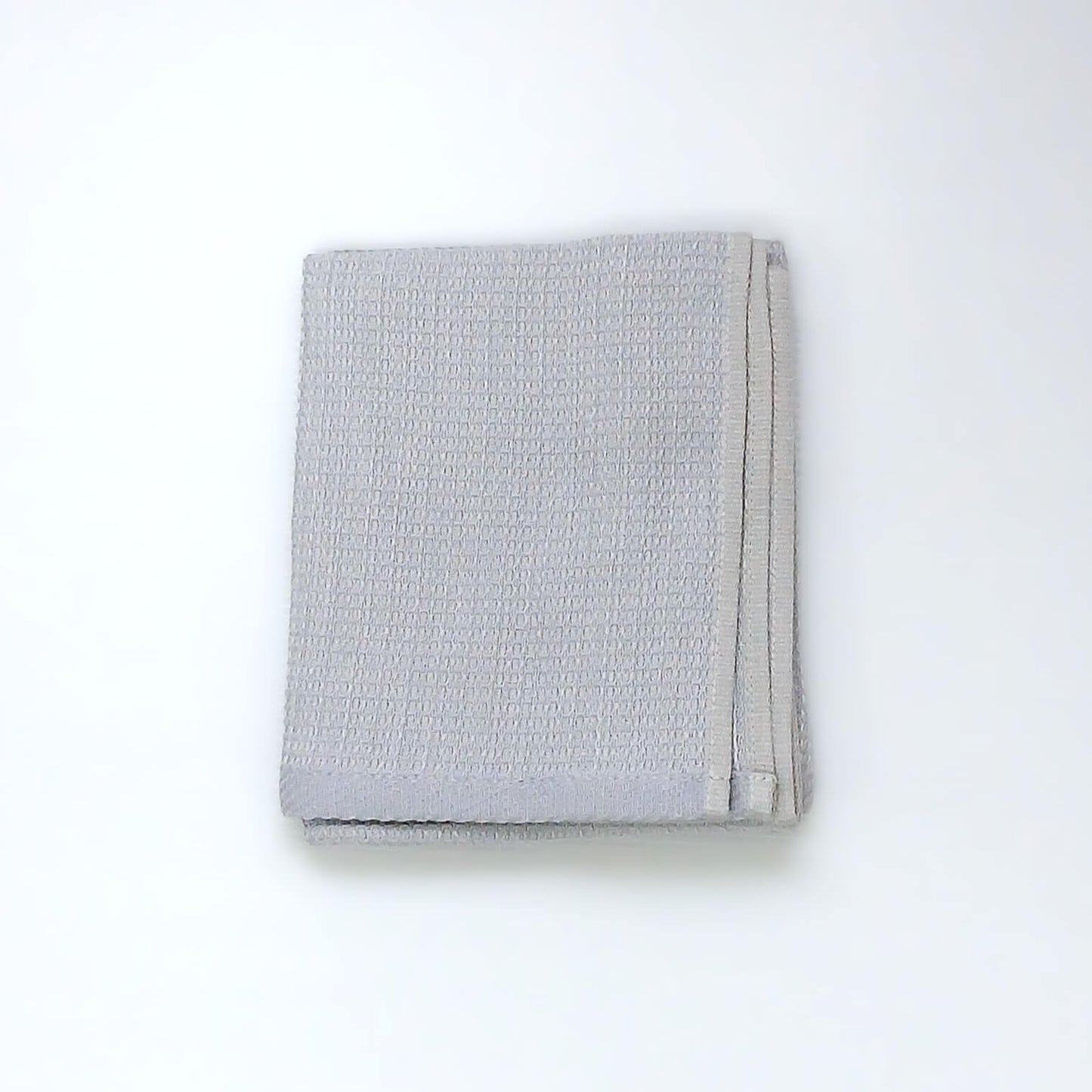 RIDGE MOUNTAIN GEAR Waffle Neck Wrap Towel ワッフルネックラップタオル Fog Blue をたたんで折り重なった厚みを見せた状態の実物写真 - 山道具とULギアのお店 Ascend Lite