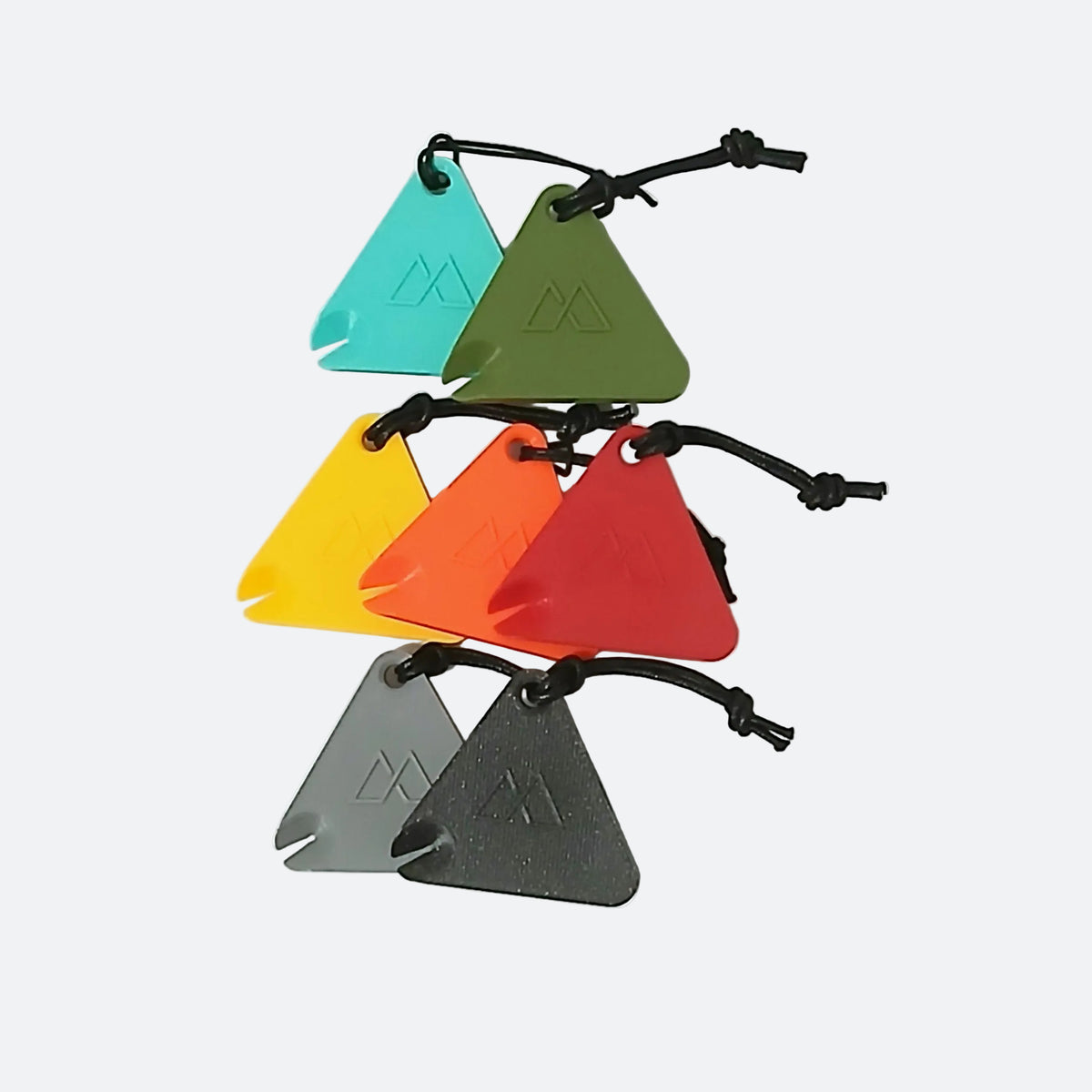 LITEWAY TRINKET WHISTLE トリンケットホイッスル 全7色の実物集合 - Spanish Teal・Olive・Yellow・Orange・Red・Grey・Blackを重ねて並べたカットで、いずれもコードとコードロック付き - 山道具とULギアのお店 Ascend Lite