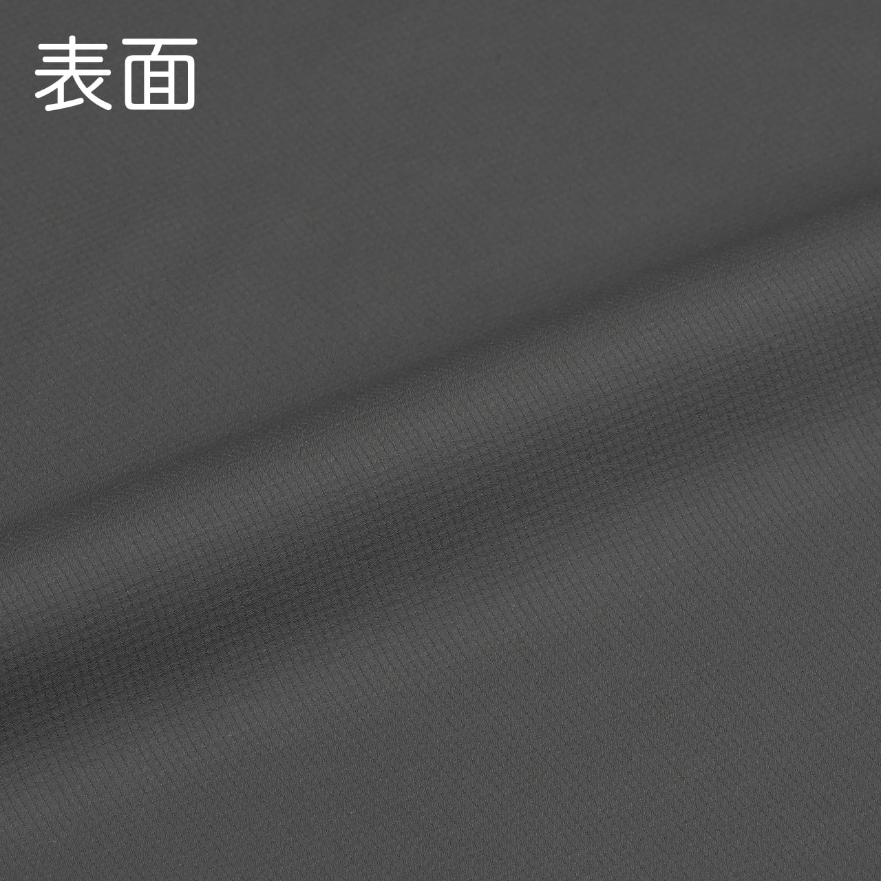 RIDGE MOUNTAIN GEAR Enough Shell Jacket イナフシェルジャケット Pertex Equilibrium 49g/㎡ 生地の表面を接写した質感カット 表面 表記入り（公式画像） - 山道具とULギアのお店 Ascend Lite