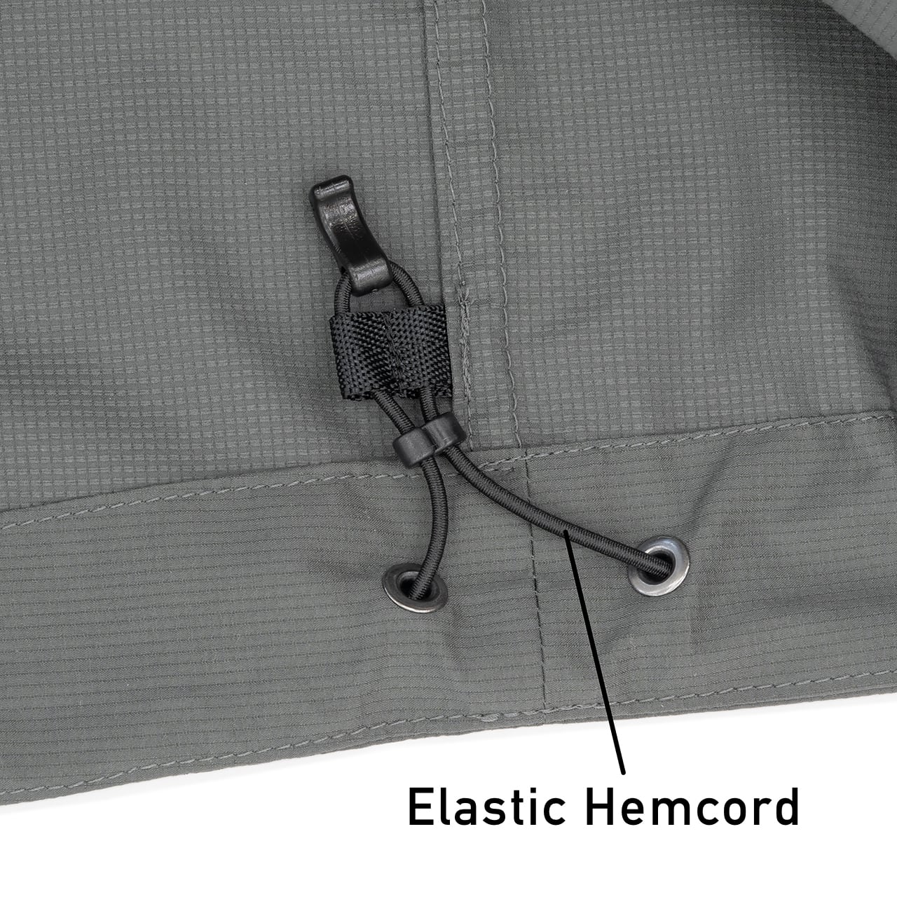 RIDGE MOUNTAIN GEAR Enough Shell Jacket イナフシェルジャケット 裾の2mmゴムコードとコードロックのクローズアップ Elastic Hemcord 表記入り（公式画像） - 山道具とULギアのお店 Ascend Lite