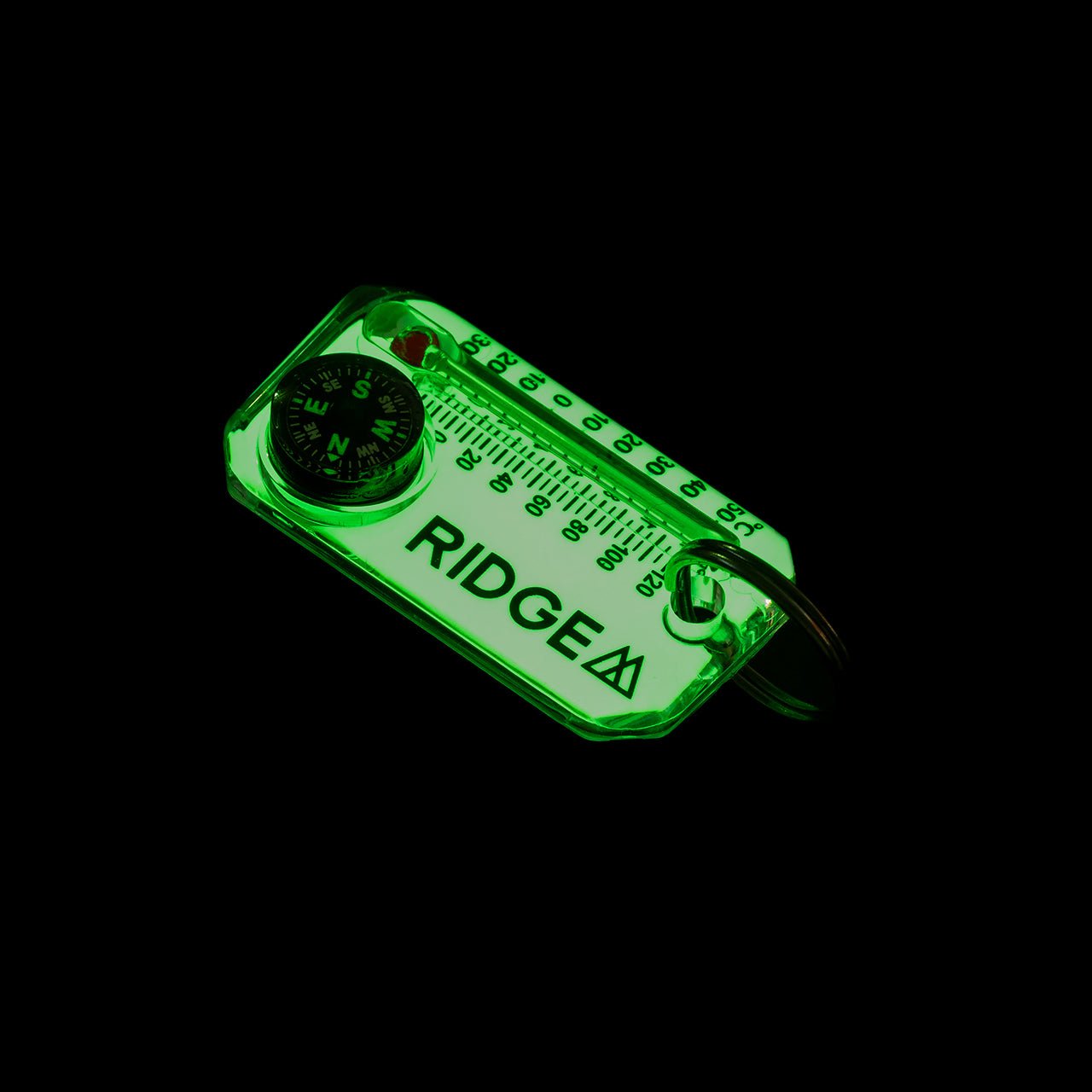 RIDGE MOUNTAIN GEAR Therm-o-compass サーモコンパス LumaGage（蓄光）が暗闇で緑色に発光した状態（公式画像） - 山道具とULギアのお店 Ascend Lite