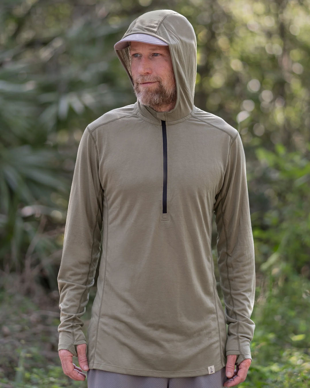 Zpacks Mirage Merino Sun Hoody ミラージュメリノサンフーディ Light Olive - 森の中でフードをかぶった着用シーン（公式画像） - 山道具とULギアのお店 Ascend Lite